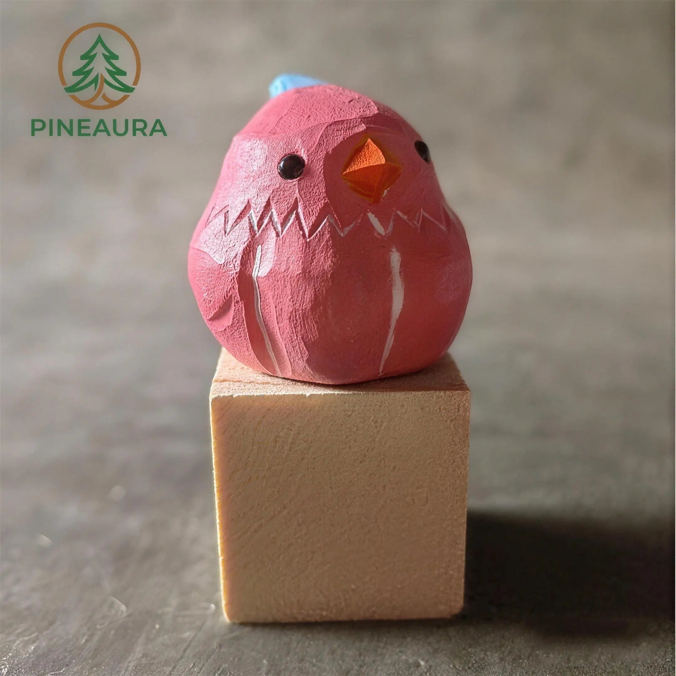 A Wooden Blue Bird Sculpture Named Raspberry Fluff