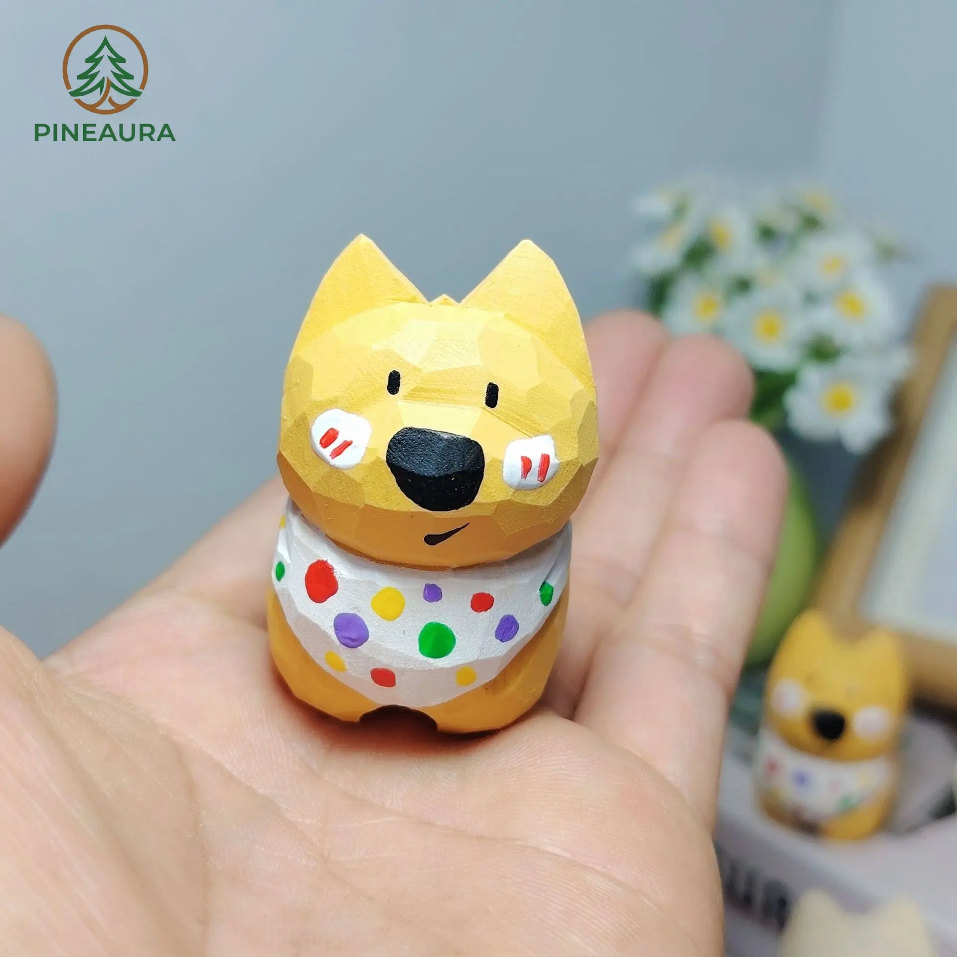 Adorable low-poly yellow West Highland Terrier figurine with white polka dot bandana, held in hand by PINEAURA